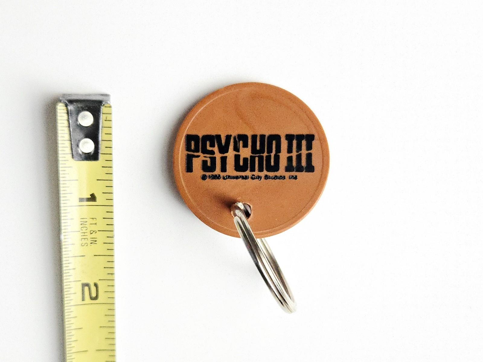 VINTAGE 1986 PSYCHO III MOVIE PROMO KEYCHAIN BATES MOTEL HORROR FILM 3 UNIVERSAL