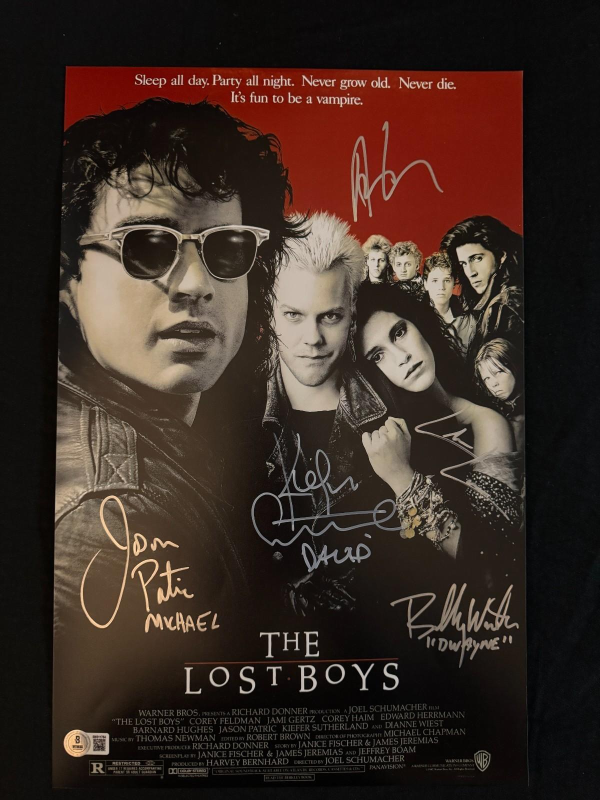 The Lost Boys cast signed (Names in Disc) 11x17 photo W/Beckett witnessed COA