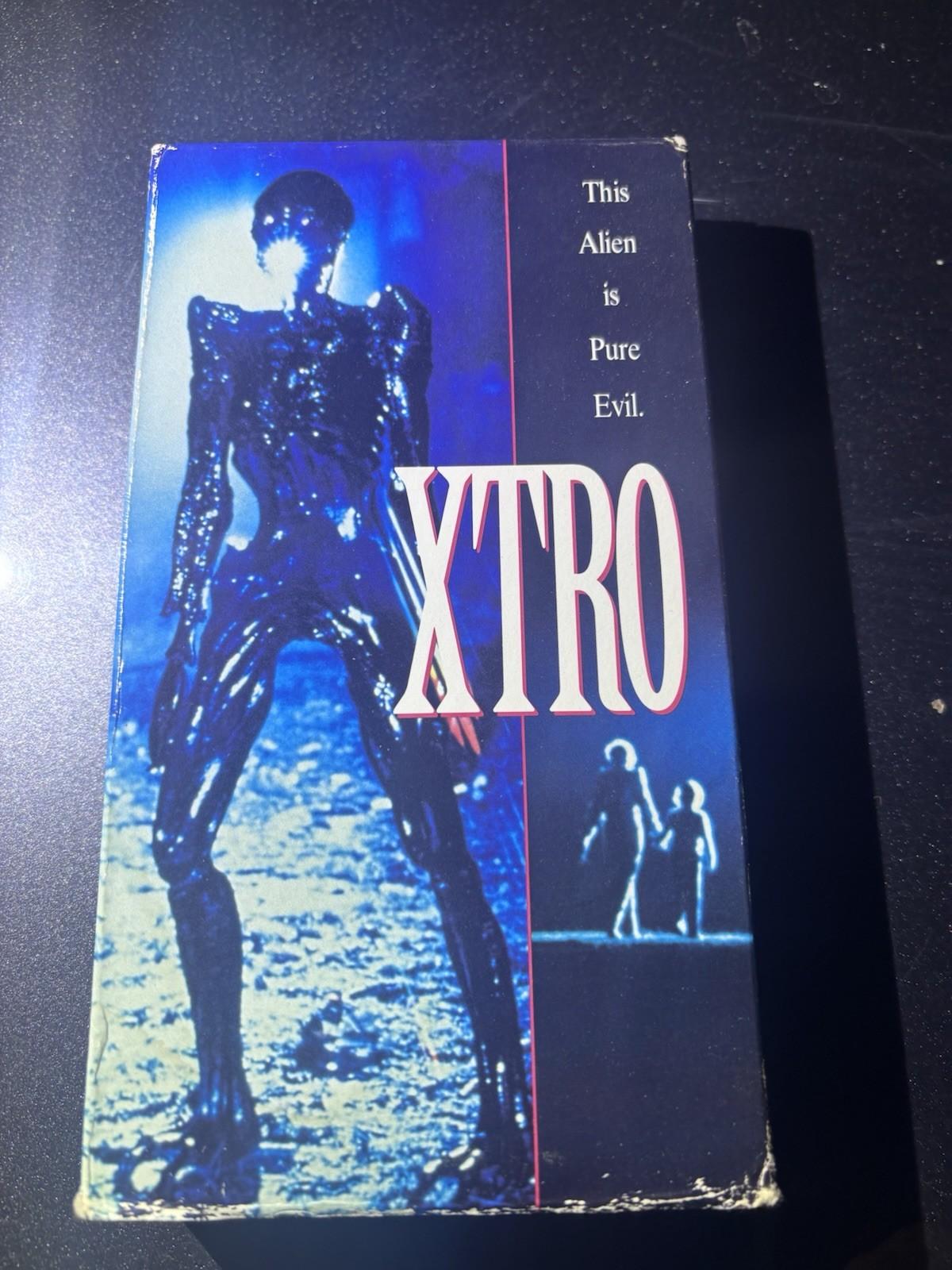 Xtro VHS VCR Video Tape Used Movie Horror Sci Fi Slip Sleeve RARE